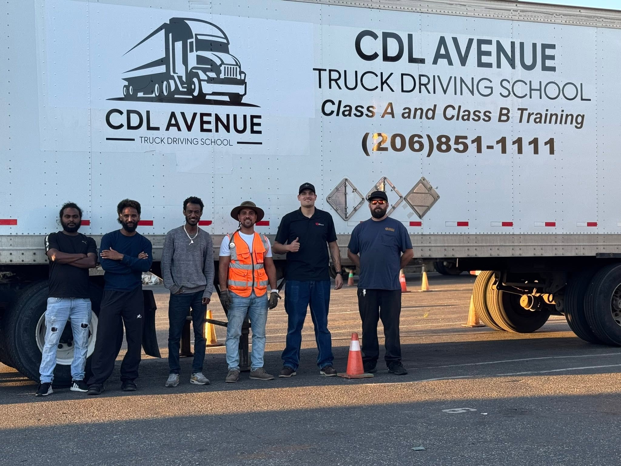 CDL Avenue students with Rafi in front of the CDL Avenue truck