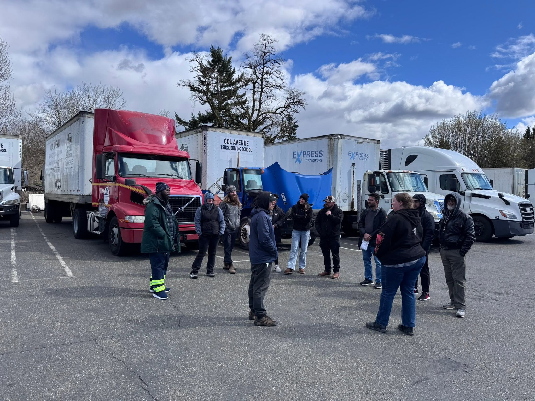 Students and trucks at the CDL Avenue training lot