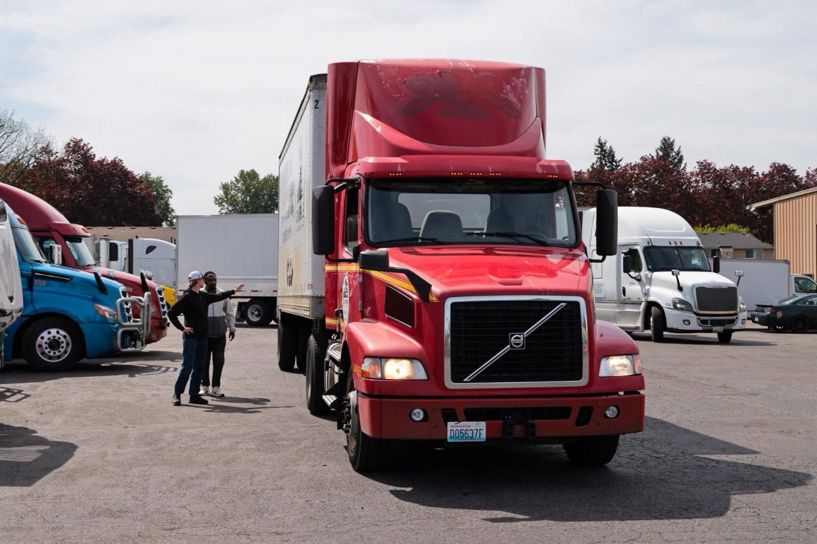 Red Volvo semi truck at CDL Avenue training yard