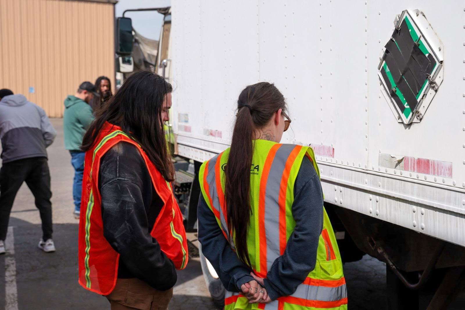 Students in safety vests during hands-on training